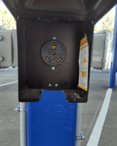 A plug for electric and hybrid plug-in cars located in the vehicle storage area