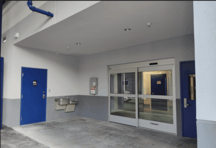 Entrance to indoor units with a water fountain and cover